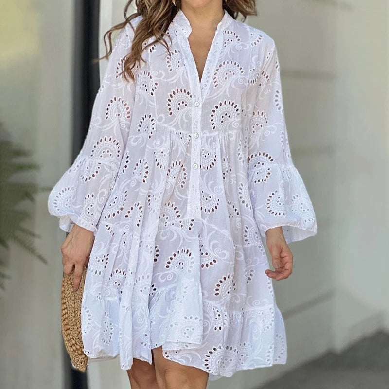 Elegant vintage summer dress in smooth lace with a V-neck, loose fit, and sheer details with embroidery.
