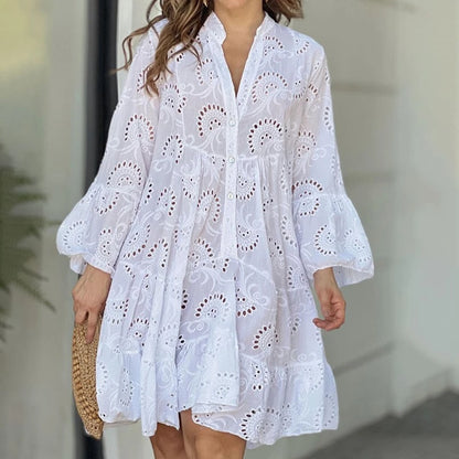 Elegant vintage summer dress in smooth lace with a V-neck, loose fit, and sheer details with embroidery.
