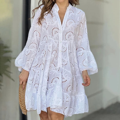 Elegant vintage summer dress in smooth lace with a V-neck, loose fit, and sheer details with embroidery.
