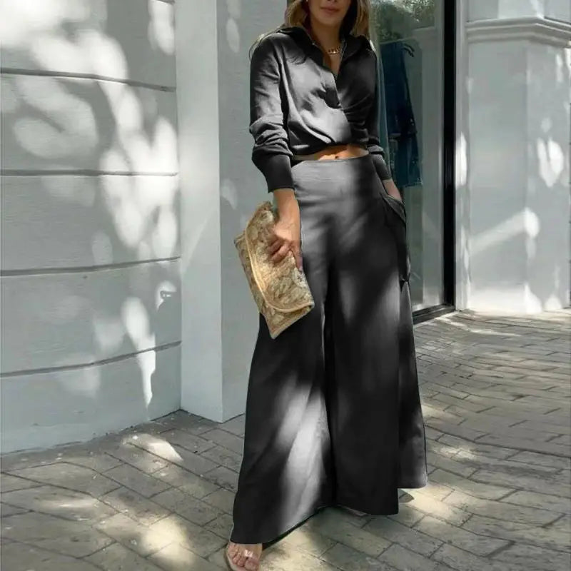 Women's formal outfit with cropped shirt and tailored wide-leg trousers