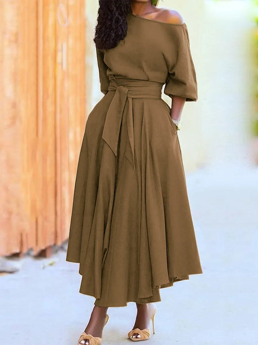 Elegant women's off-the-shoulder midi dress with a flared silhouette, defined waist, and pockets