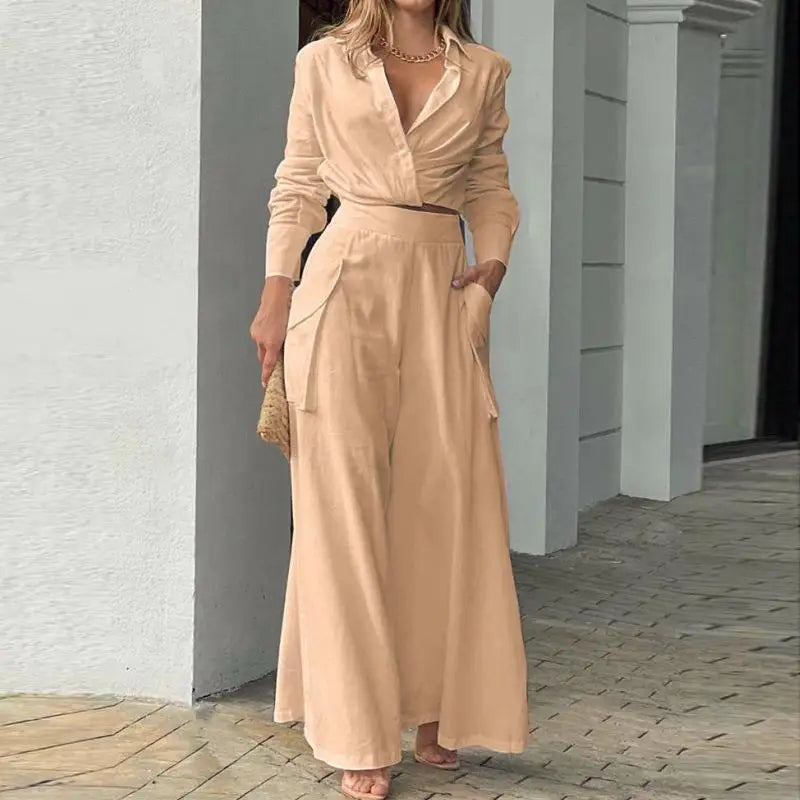 Women's formal outfit with cropped shirt and tailored wide-leg trousers