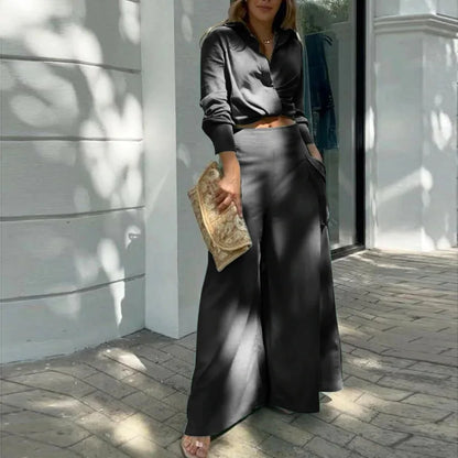 Women's formal outfit with cropped shirt and tailored wide-leg trousers