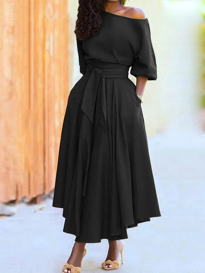 Elegant women's off-the-shoulder midi dress with a flared silhouette, defined waist, and pockets