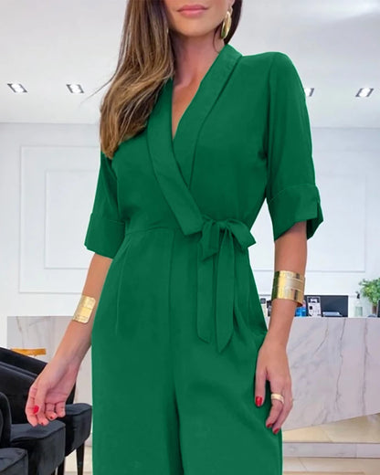 Elegant women's jumpsuit with a V-neck, 3/4 sleeves, defined waist, and wide legs