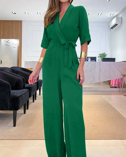 Elegant women's jumpsuit with a V-neck, 3/4 sleeves, defined waist, and wide legs